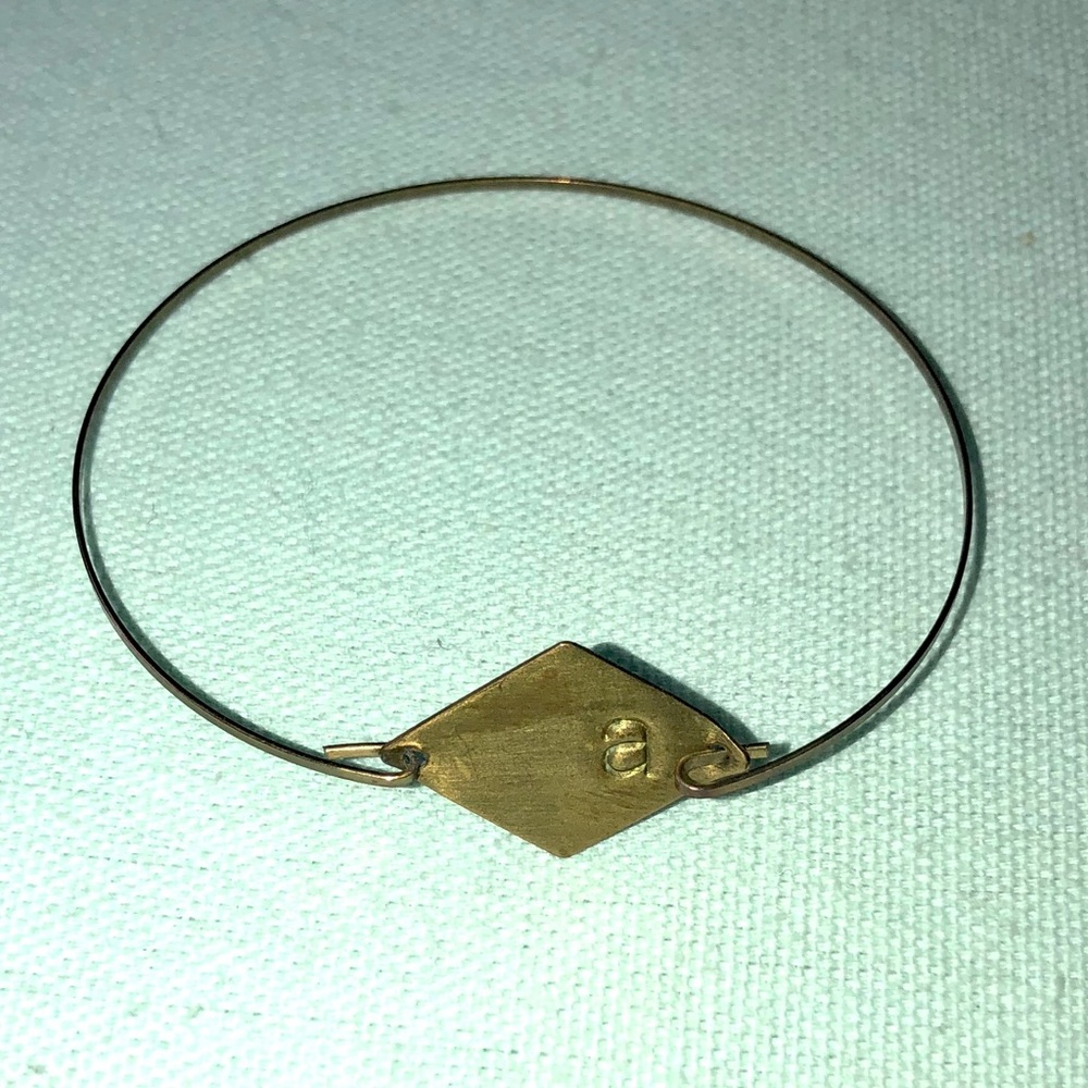 Metal stamped “A” bracelet